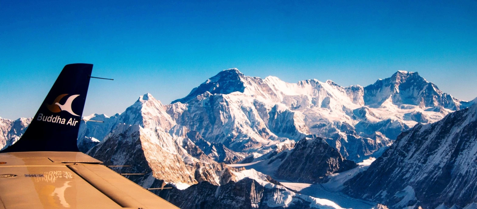 Panoramic Himalayan peaks seen from the window of a Nepal mountain flight
